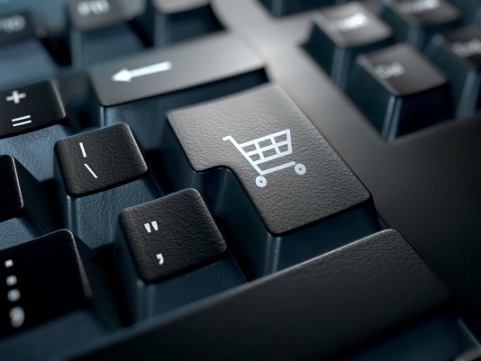Online shopping cart icon on keyboard