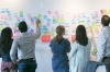 People working together on ideation wall