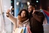 African American man and woman taking a selfie while shopping