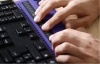 Hands on a braille keyboard