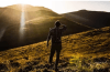 Man standing on top of a hill