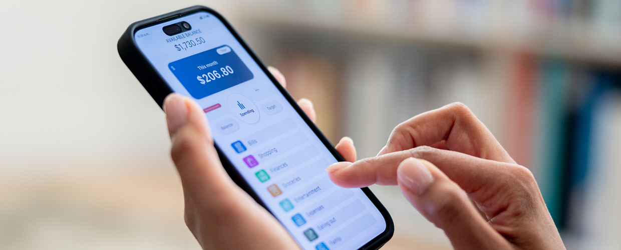A hero image for Awareness blog post #1 (2X: Banking). A picture of a close up screen of a banking app