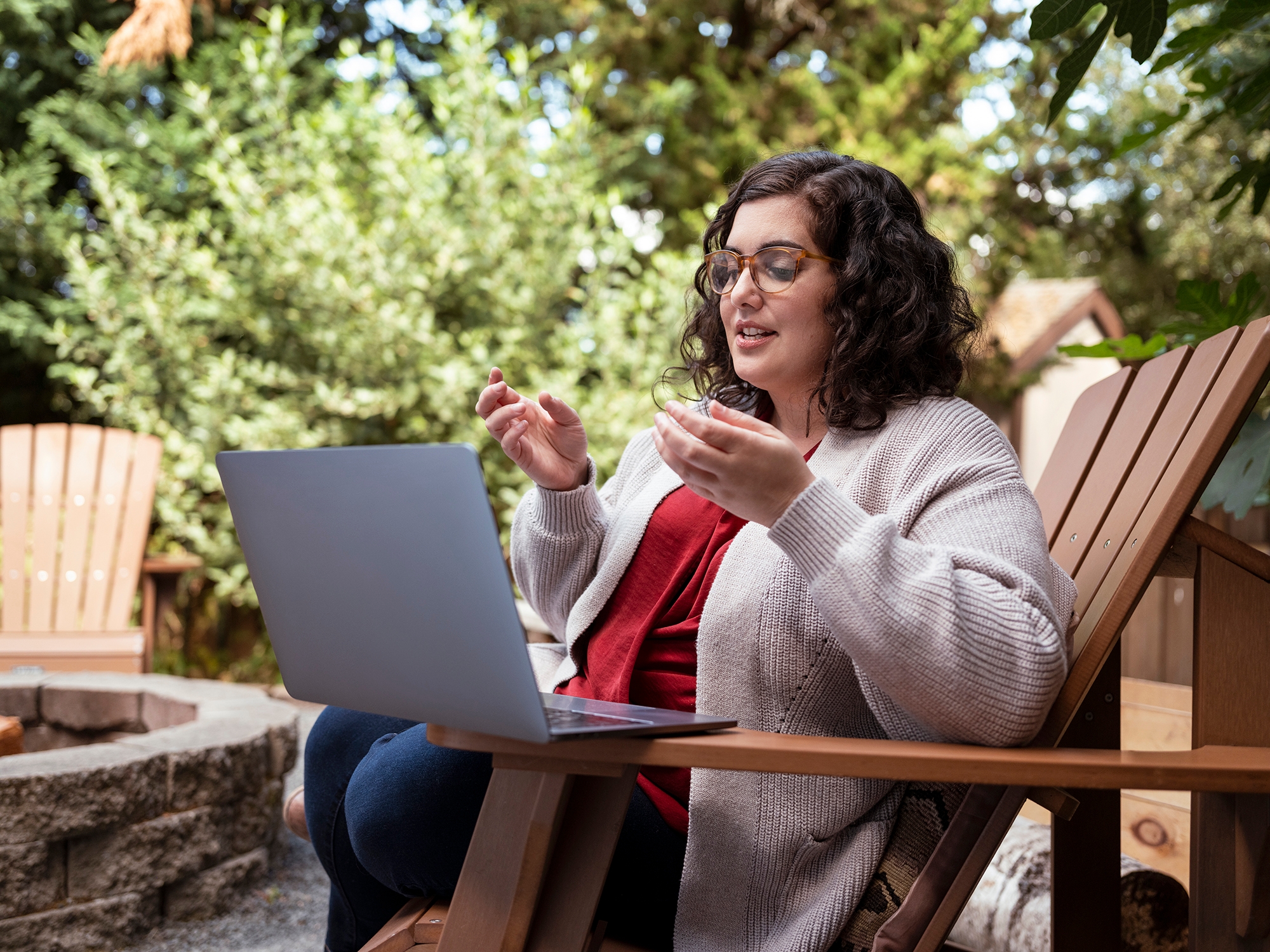 Kristen sharing insights interview with laptop