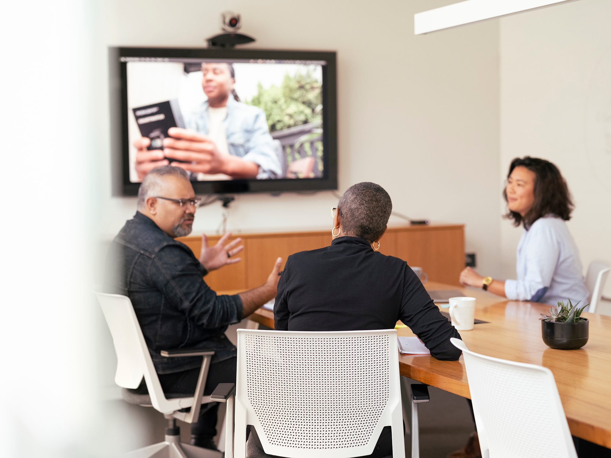 Marketing team in meeting reviewing user interview