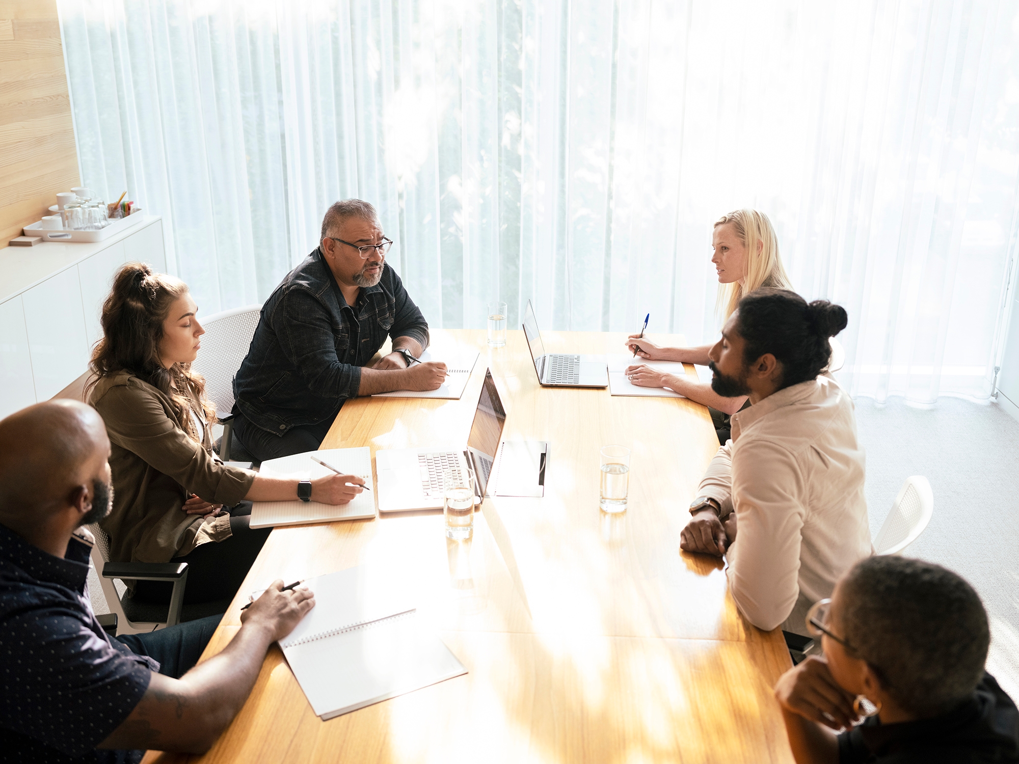 UX team in meeting reviewing research
