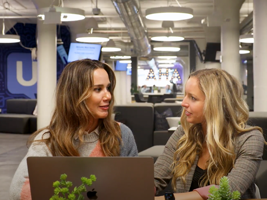 Office image of UserTesting employees, sharing empathy