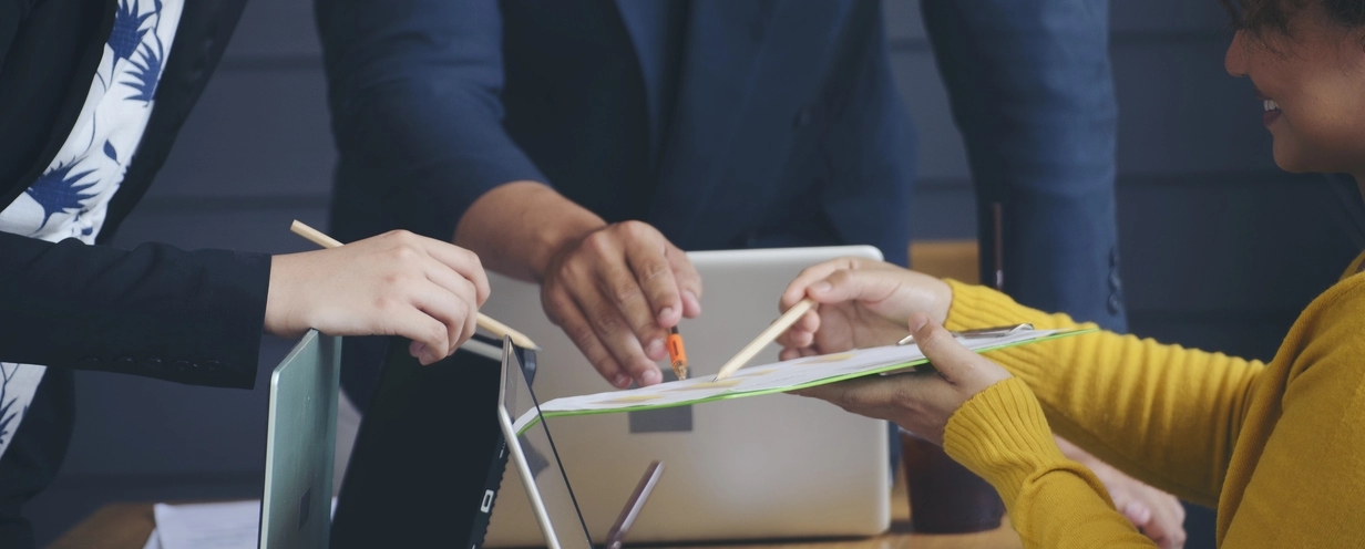 Image of people looking at a business plan