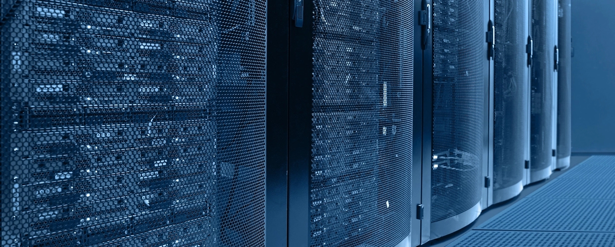 Photo of a data center with rows of mainframe computers