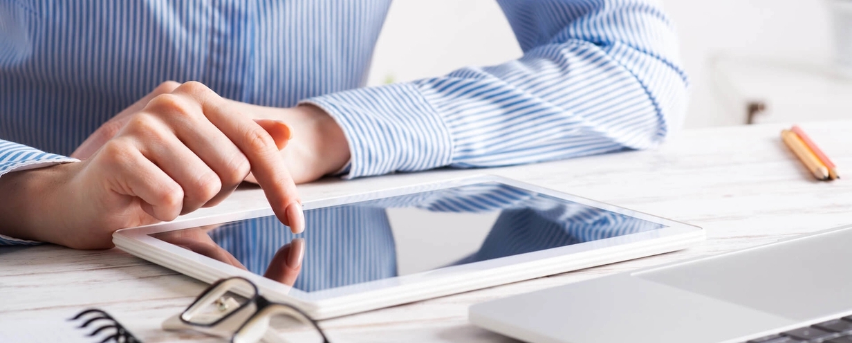 Photograph of woman using a tablet