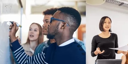 Photo of a team in a working session with 3 people at a whiteboard while one person is speaking to the group