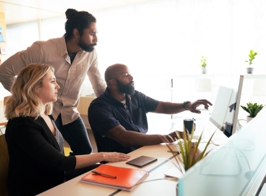 coworkers looking at computer