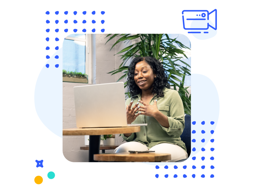 Decorative image of a woman sitting in front of a laptop speaking and gesturing with her hands