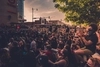 Photo of a crowd in COVID masks protesting