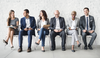 Picture of a group of people waiting to be interviewed