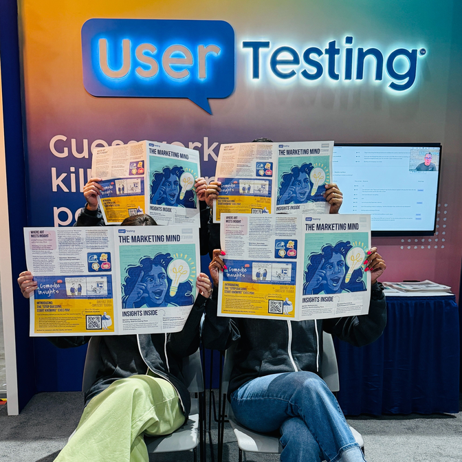 UserTesting employees reading the special edition newspaper, The Marketing Mind