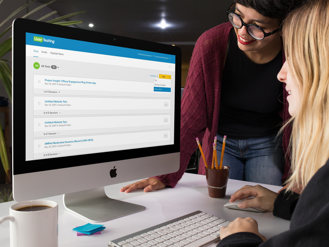 Photo of two business professionals looking at a computer monitor