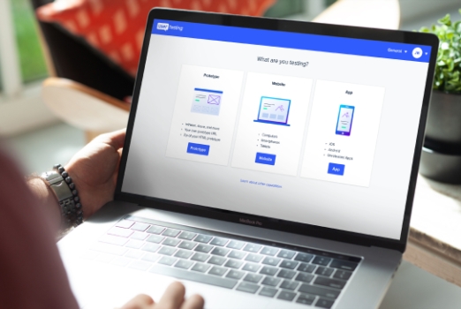 person doing user testing on a laptop