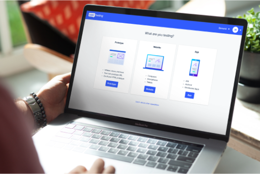 person doing user testing on a laptop
