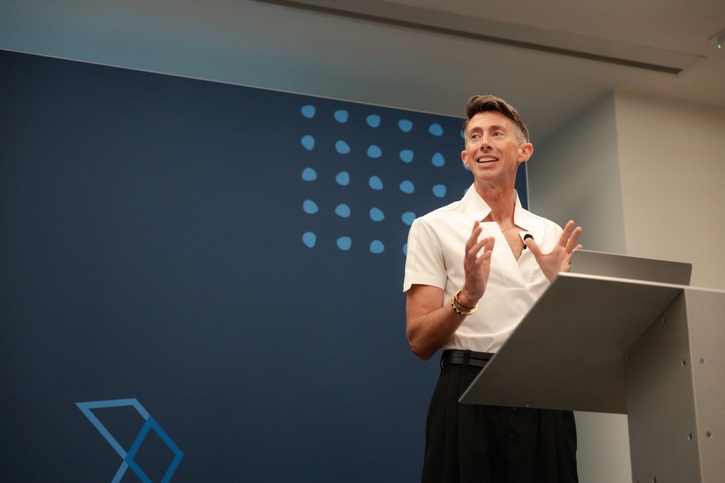 Bobby speaking on stage